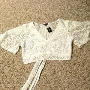 White crop express top . Ties in the back never worn size medium